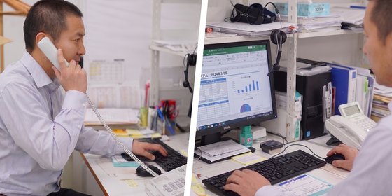 担当者が電話とパソコンでお客様の相談に対応している様子